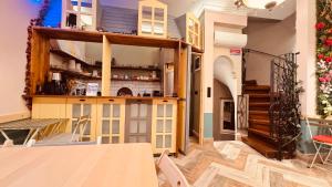 a room with a table and chairs and a staircase at The House Company in Istanbul +38 photos