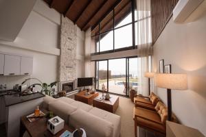 a living room with a couch and a large window at Voger Sapanca Lake View in Sapanca +90 photos