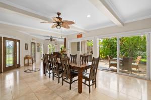 a dining room with a table and chairs at Princeville/Hanalei Lux 4BR 3.5Ba w/AC+CAR in Princeville