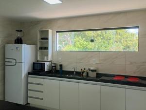 Køkken eller tekøkken på Apartamento em Conde - Praia de Jacumã e Carapibus