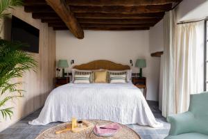 a bedroom with a large bed and a table at Number One Bruton in Bruton