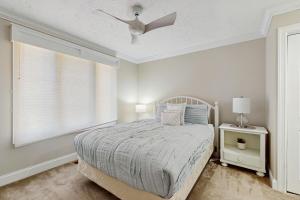 a bedroom with a bed and a ceiling fan at Trout Creek Condo Resort: Condo 78 in Conway +20 photos