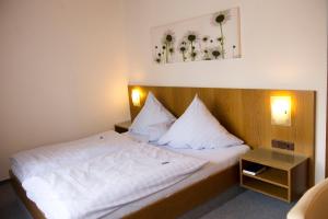 Ένα ή περισσότερα κρεβάτια σε δωμάτιο στο Landhaus Friedrichsfehn