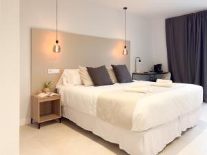 Postel nebo postele na pokoji v ubytování TAYP Navalmoral