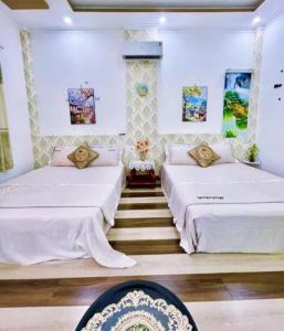 Postel nebo postele na pokoji v ubytování Hoàng Nga 2 Homestay