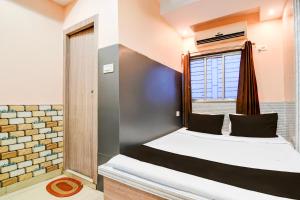 Ένα ή περισσότερα κρεβάτια σε δωμάτιο στο Hotel O Sana