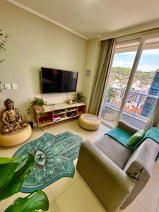 TV a/nebo společenská místnost v ubytování Studio boutique Pátio Milano 500m Beira Mar shopping + 24 fotografií