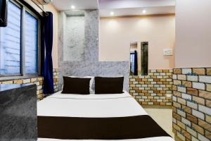 Ένα ή περισσότερα κρεβάτια σε δωμάτιο στο Hotel O Sana