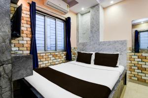 Ένα ή περισσότερα κρεβάτια σε δωμάτιο στο Hotel O Sana