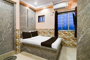 Ένα ή περισσότερα κρεβάτια σε δωμάτιο στο Hotel O Sana