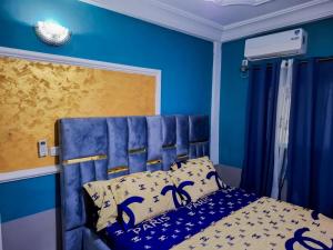 Ένα ή περισσότερα κρεβάτια σε δωμάτιο στο BITGA Home