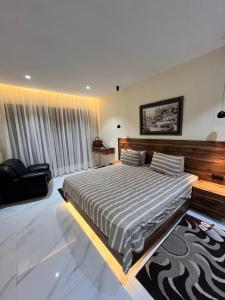 a bedroom with a large bed in a room at maisoncarnot in El Biar