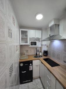 Kuchyň nebo kuchyňský kout v ubytování Departamento primera línea frente al casino. + 2 fotografie