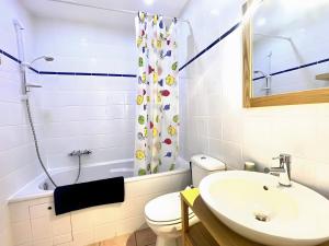 a bathroom with a sink and a toilet and a shower at Gîte Ponpon - Les Petites Écuries in Marseillette +9 photos