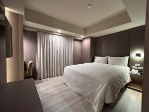 Postel nebo postele na pokoji v ubytování Forward Suites Ⅰ + 52 fotografií