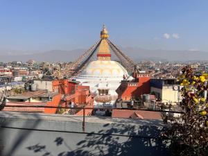 a view of a large building with a roof at Bedroom with Balcony and Boudha Stupa View in Kathmandu +16 photos