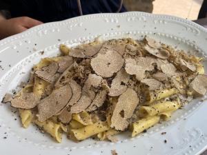 a white plate of food on a table at San Mauro Countryside Retreat with Restaurant & Wine Cellar in Momjan