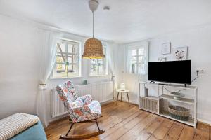 TV a/nebo společenská místnost v ubytování Das Häuschen 1650