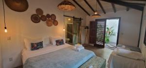 Postel nebo postele na pokoji v ubytování Pousada Vila Cacau