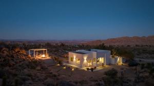 an aerial view of a house in the desert at night at Bolder House By The Cohost Company in Joshua Tree +90 photos