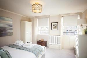 En eller flere senge i et værelse på 1 Bed in Bath oc-bhr48