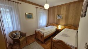 Postel nebo postele na pokoji v ubytování Ca' Piloni appartamento con 3 camere