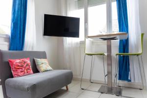 Телевизор и/или развлекательный центр в Le petit loft