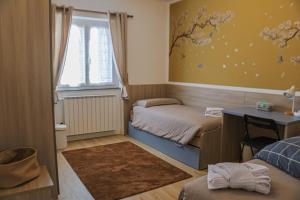 Postel nebo postele na pokoji v ubytování Casa vacanze moderna a 500m dalle piste