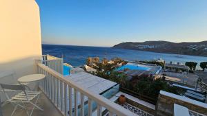 a balcony with a view of the ocean at Villa Spika with seaview and shared pool in Kalo Livadi