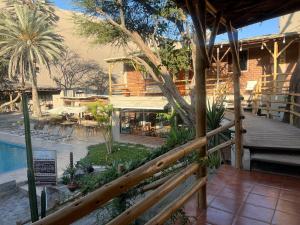 a view of a resort with a swimming pool at Hotel El Huacachinero- Hotel Familiar in Ica