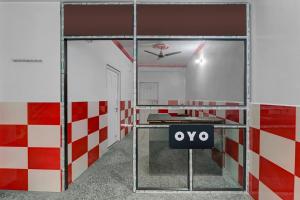 an open door in a room with a exit sign at SPOT ON Hotel Parvati Resort in Suitha