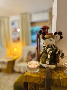 a stuffed animal sitting on top of a table at Dom wakacyjny nad Jeziorem Dadaj in Biskupiec