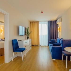 TV a/nebo společenská místnost v ubytování Orbi City Luxury Hotel + 25 fotografií