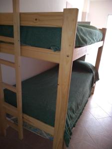 Ένα ή περισσότερα κρεβάτια σε δωμάτιο στο Casa a una cuadra de la playa