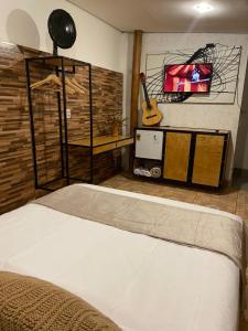 Ένα ή περισσότερα κρεβάτια σε δωμάτιο στο Loft da Lu