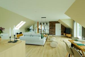 a living room with a couch and a table at Apartament NaWidoki in Sępólno Krajeńskie