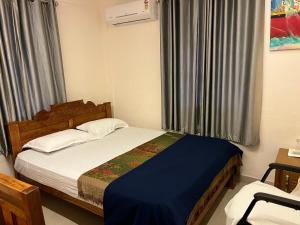 En eller flere senge i et værelse på Ragaveena, your home away from home