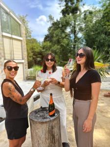 a group of three women holding glasses of wine at StyLove-Apartamenty in Ustroń