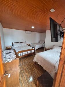 Ένα ή περισσότερα κρεβάτια σε δωμάτιο στο Hospedaje Ahumada