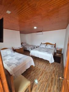 Ένα ή περισσότερα κρεβάτια σε δωμάτιο στο Hospedaje Ahumada +14 φωτογραφίες