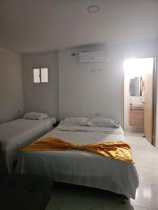 Postel nebo postele na pokoji v ubytování Vacacional N 303