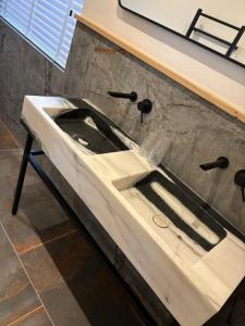 a white sink in a bathroom in a room at St Oswalds Estate Lodges in Whitby