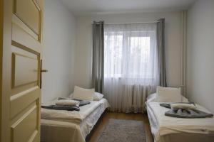 Postel nebo postele na pokoji v ubytování Szent Ferenc Vendégház