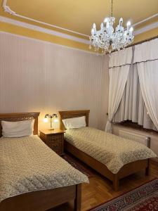 Ένα ή περισσότερα κρεβάτια σε δωμάτιο στο Rezydencja Janków