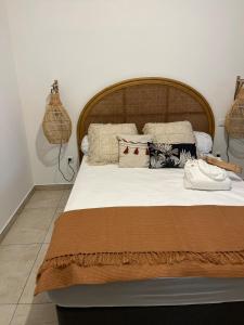 En eller flere senge i et værelse på Case Ylang Blossom maison neuve avec piscine