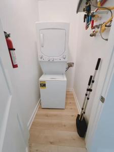 a stairway with a washing machine in a room at Weekend Escape on the Coast-Relax & Unwind in Pass Christian