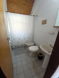 a bathroom with a toilet and a sink at La Casa De Yayo in San Luis