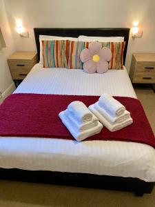 Voodi või voodid majutusasutuse Simla Bungalow, Tetney toas