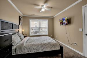 a bedroom with a bed and a ceiling fan at Spacious 3 bed 3 bath Apartment No stairs in Buffalo