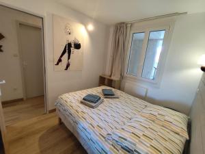 Postel nebo postele na pokoji v ubytování Appartement Le Refuge du Vautour